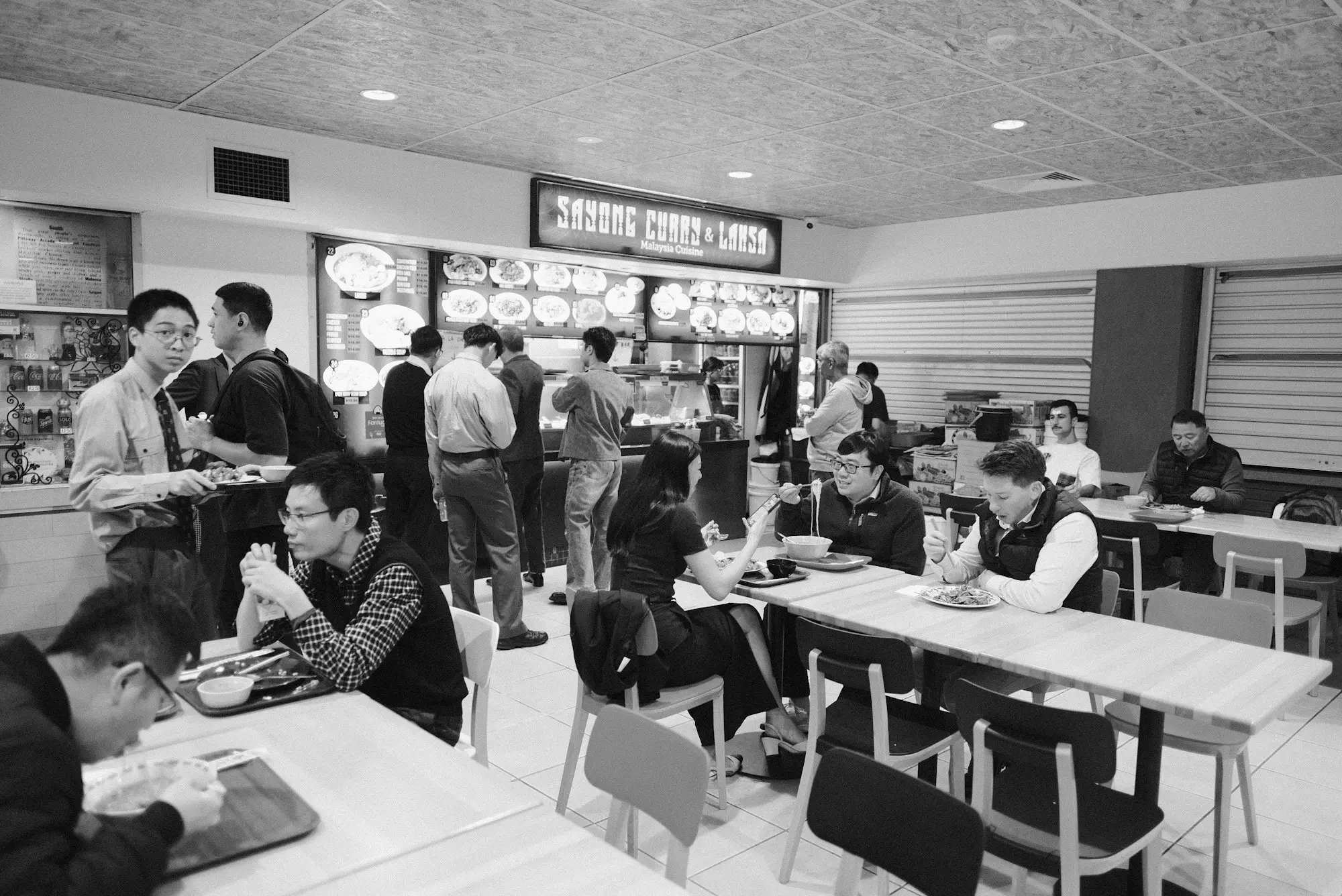 Diners filling a busy food court in a Sydney shopping arcade