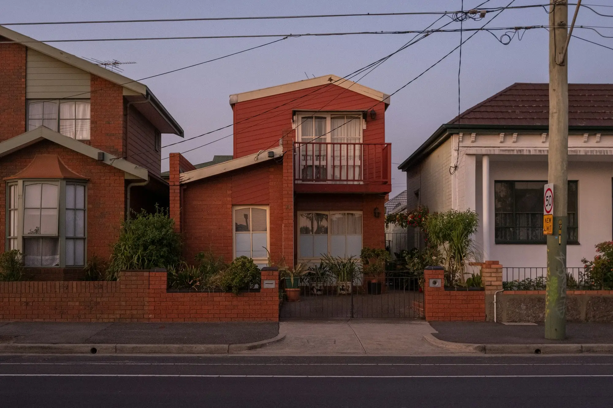 Red-brick houses on a suburban street in Brunswick, Victoria